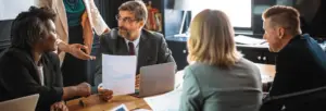 Colleagues reviewing a meeting recording together