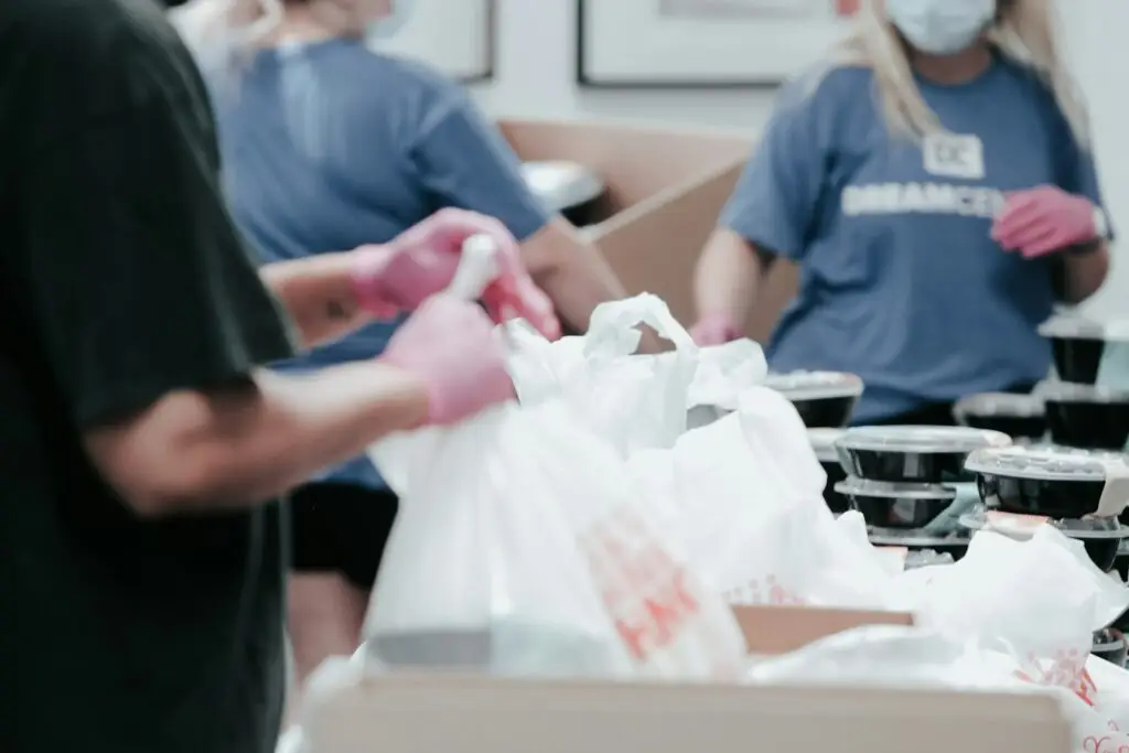 Charity volunteers packing food parcels
