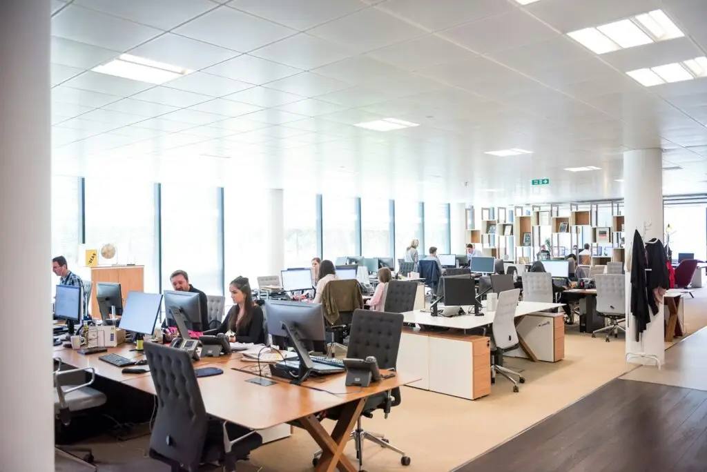 IT support team working at desks in an open-plan office