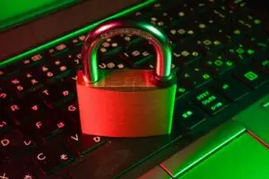 Padlock on a computer keyboard representing cyber security