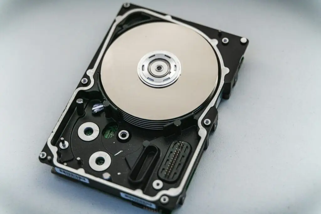 Close-up of an open hard disk drive, representing data backups that need protecting from ransomware